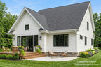 Rear exterior rendering of the Wexford modern farmhouse with a raised wood deck and ground-level patio.