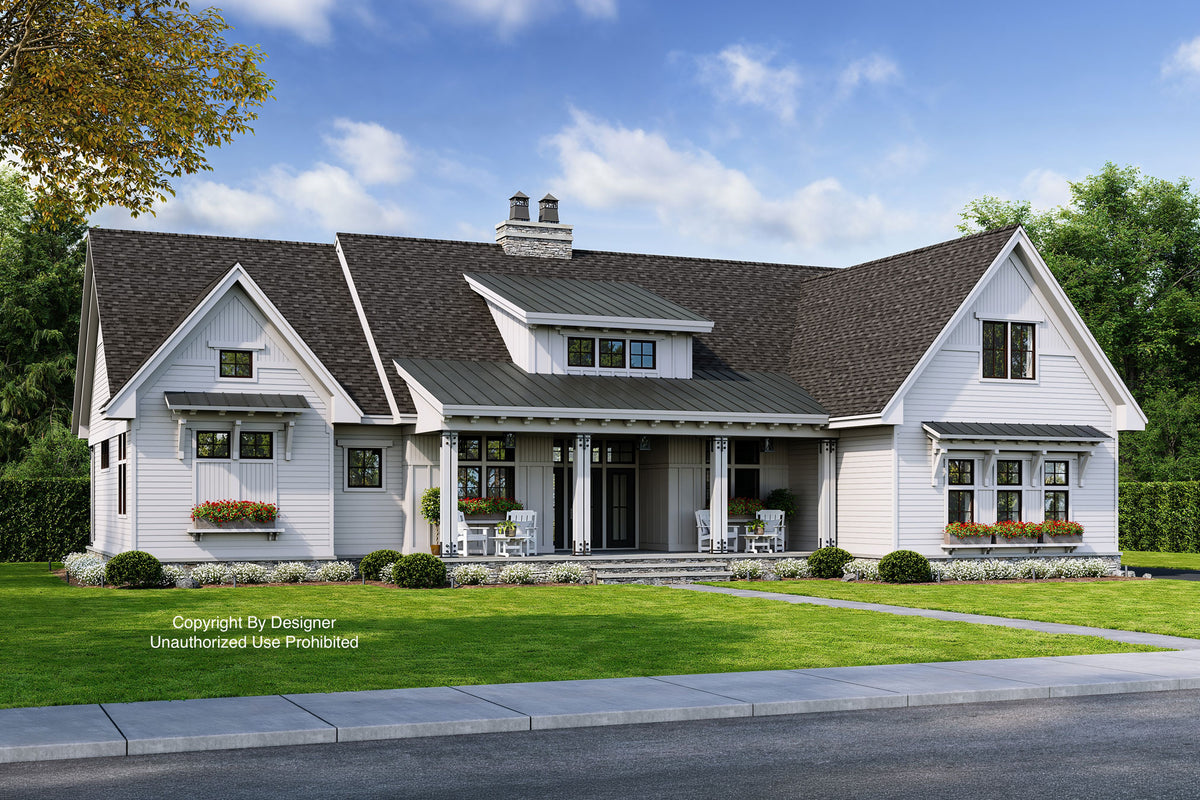 A modern farmhouse with a dark roof, metal roof over the covered front porch, it has white siding and windows boxes filled with beautiful flowers