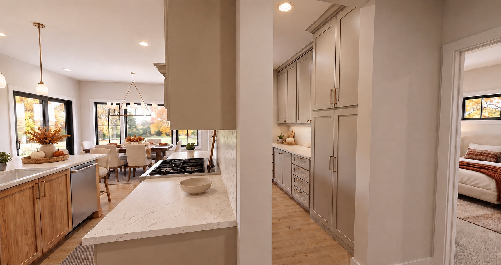 Alder Glen kitchen cooktop and stone counters beside the prep kitchen entry, with the dining area visible beyond the island.