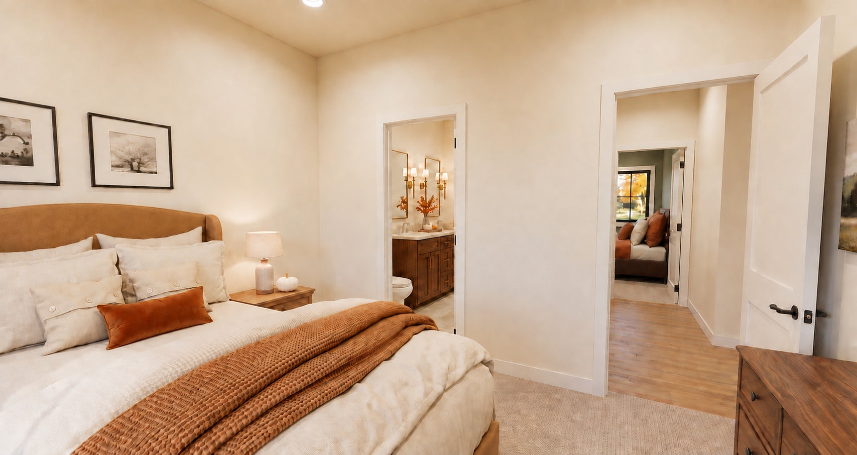 Alder Glen front bedroom looking toward the shared bathroom and hallway, with warm neutral bedding and a wood dresser.
