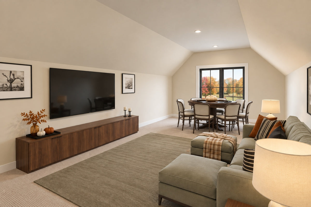 Bonus room with a green sectional, wall-mounted television, wood console and a game table beneath the far window.