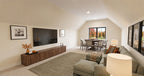 Alder Glen bonus room with a green sectional, wall-mounted television and a game table beneath the far window.