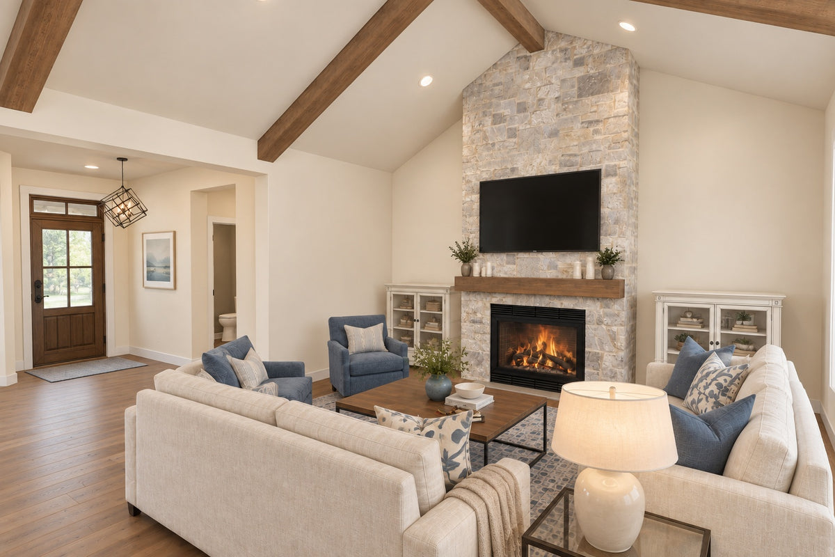 Oak Haven great room facing the stone fireplace and foyer, with cream sofas and blue armchairs around a wood coffee table.