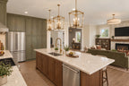 Kitchen rendering with an island sink, countertop seating and a view to the fireplace.