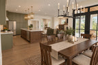 Dining-area rendering with a wood table beside the open kitchen and rear windows.