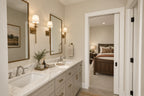 Jack and Jill bathroom rendering with a double vanity and a connecting bedroom doorway.