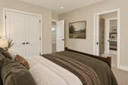 Upstairs-bedroom rendering with a double-door closet and access to the shared bathroom.