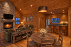 Dining area rendering with a round table between the family-room fireplace and the open kitchen eating bar.