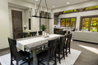 Dining area rendering with a wood table, black chandelier and views toward the great room and rear windows.