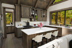 Kitchen rendering with wood cabinets, a white-topped island, three stools and windows overlooking trees.