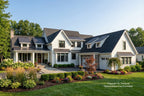 Stylish white Modern Farmhouse house with black roof 4-car garage, metal roof and garden in front